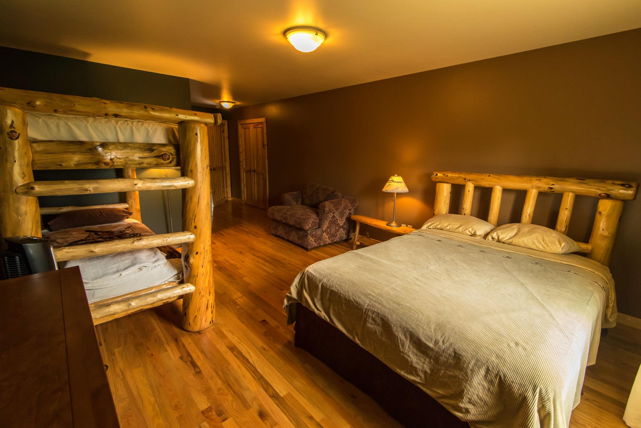 Warm-lit bedroom featuring wooden decor