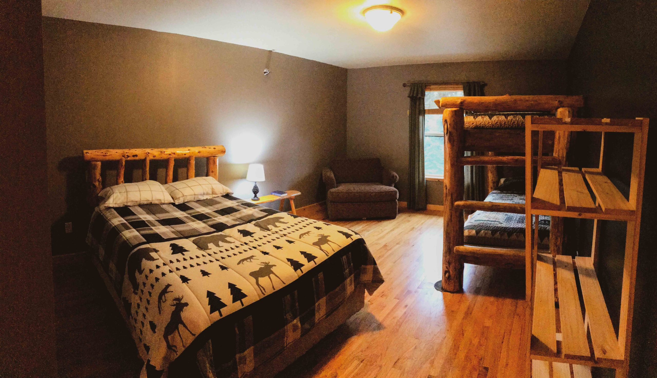 Cozy cabin-style room with wood furniture.