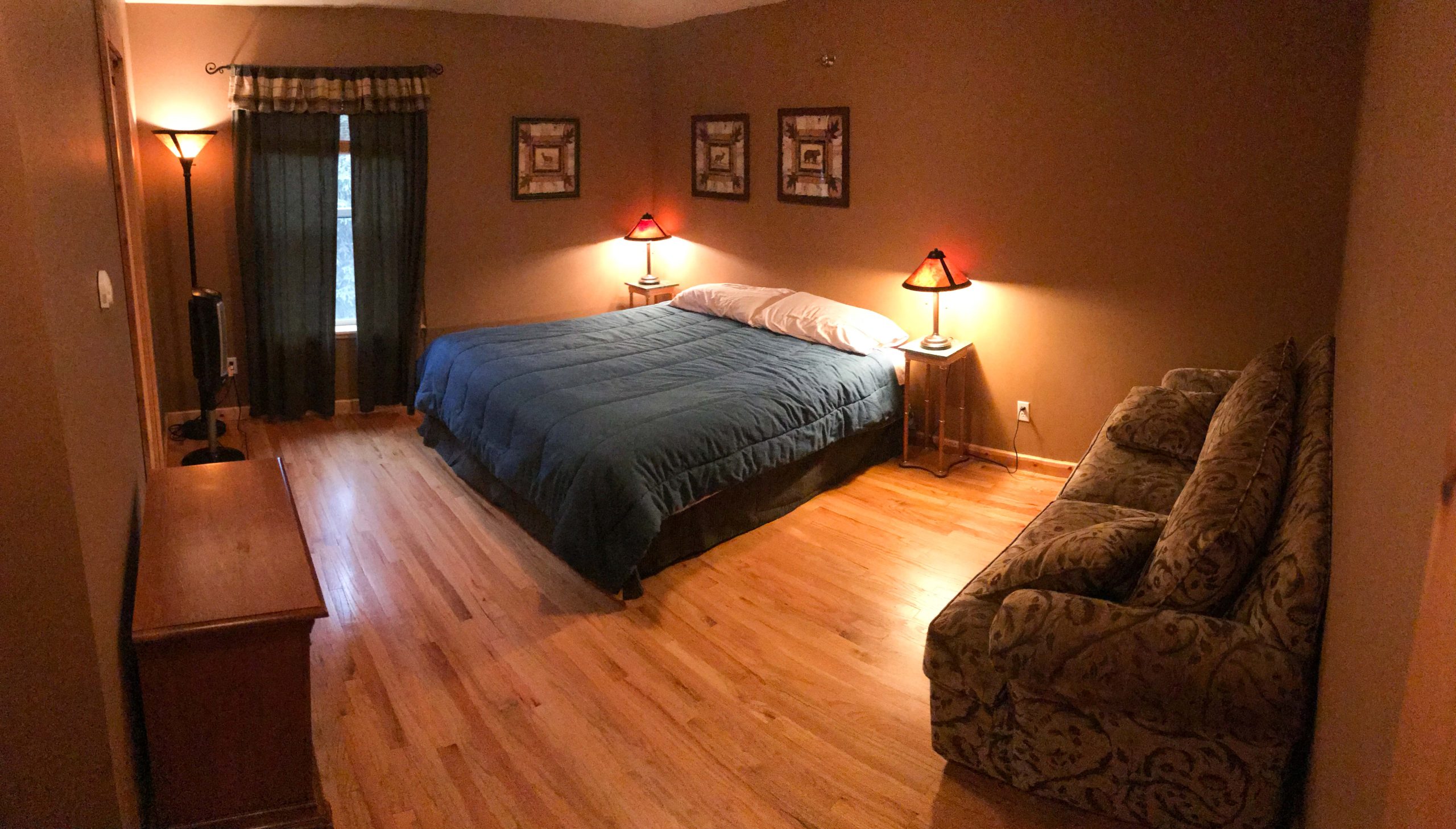 Spacious room featuring a comfortable couch