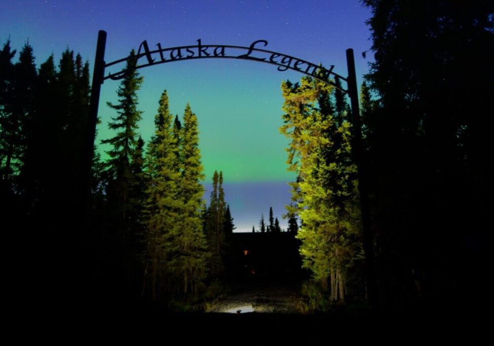Northern lights behind Alaska Legends sign