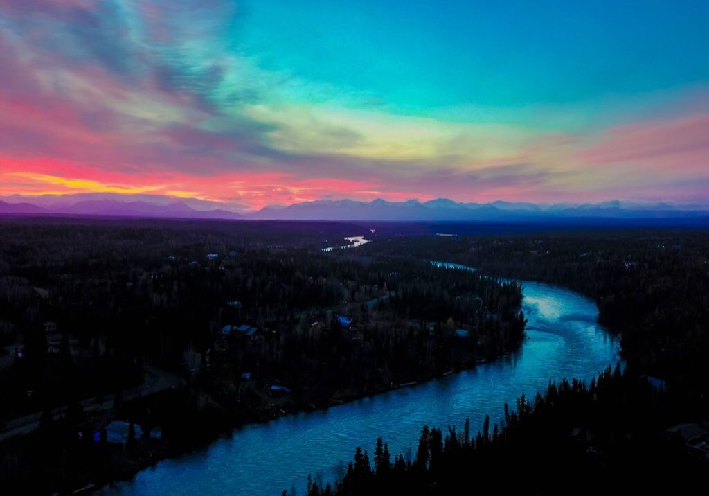 Serene dusk scene with colorful horizon.