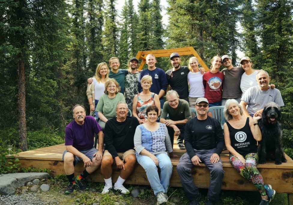 Group gathered on wooden deck outdoors